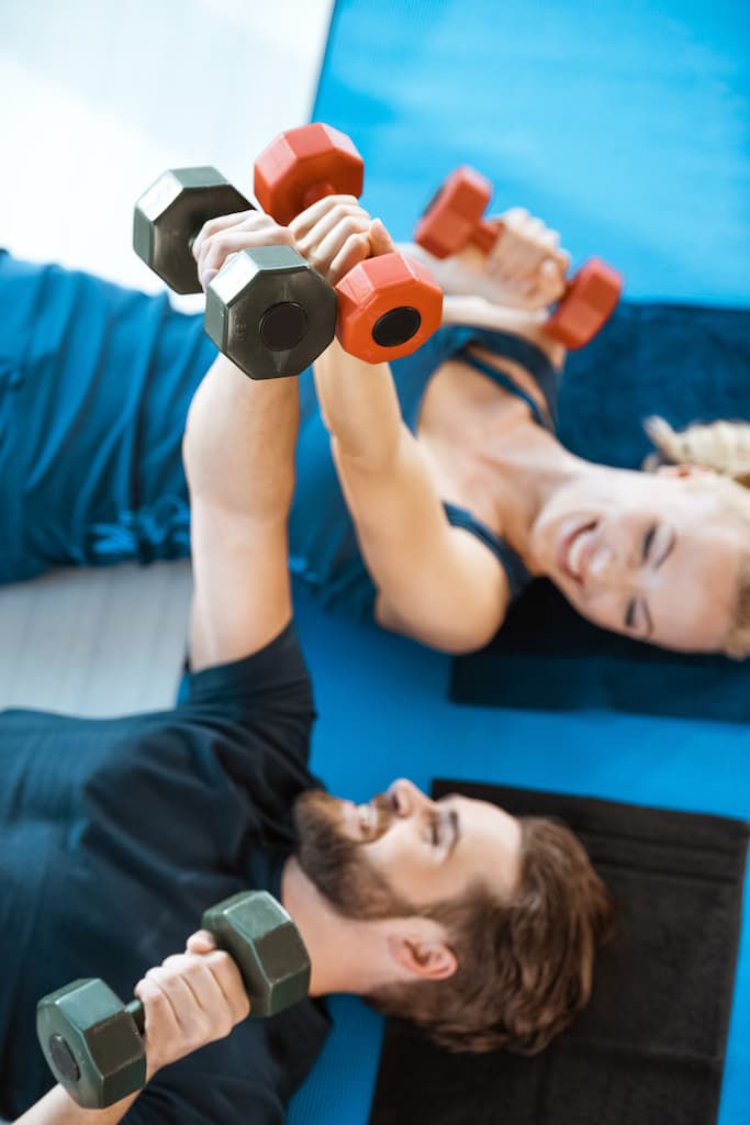 Two trainees working out together.